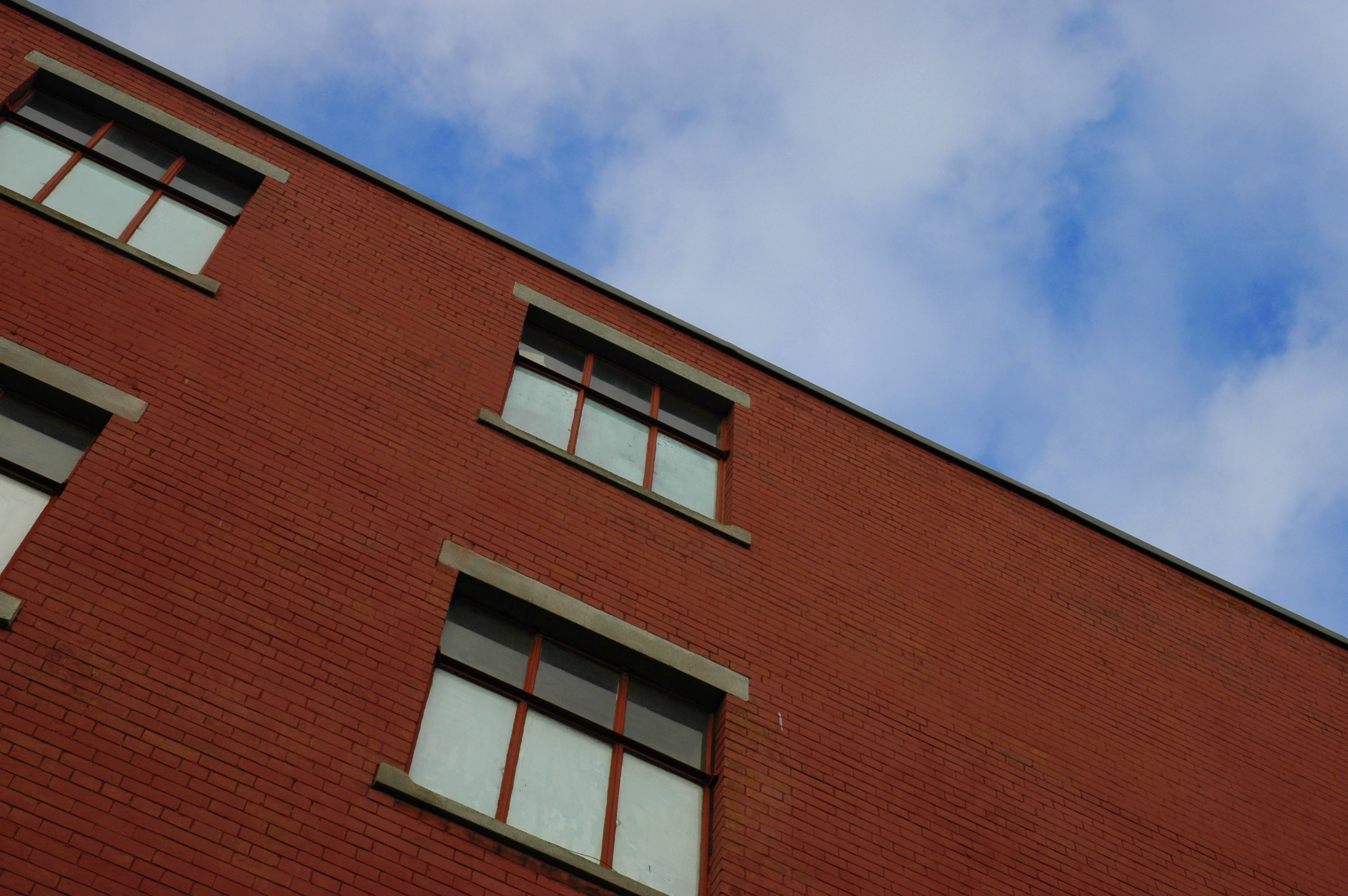 red brick building with blue sky